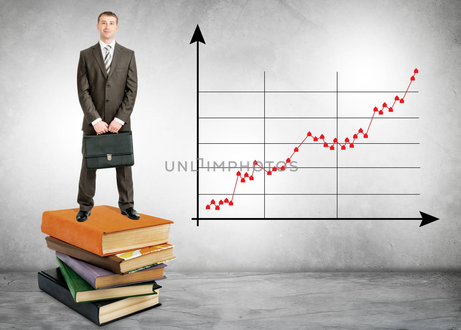 Businessman standing on books with chart by cherezoff