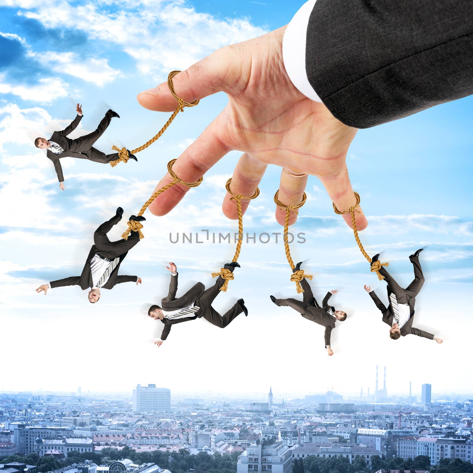 Businessmen hanging on strings like marionette by cherezoff