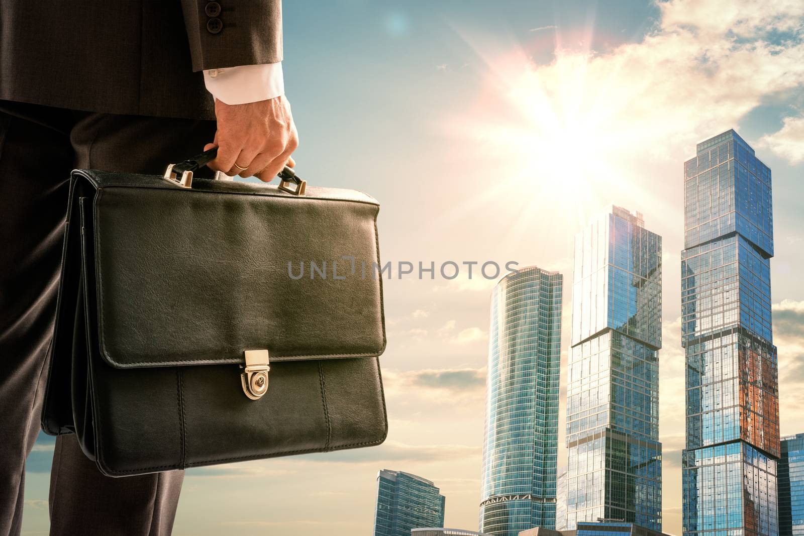 Man with suitcase looking on city, closeup