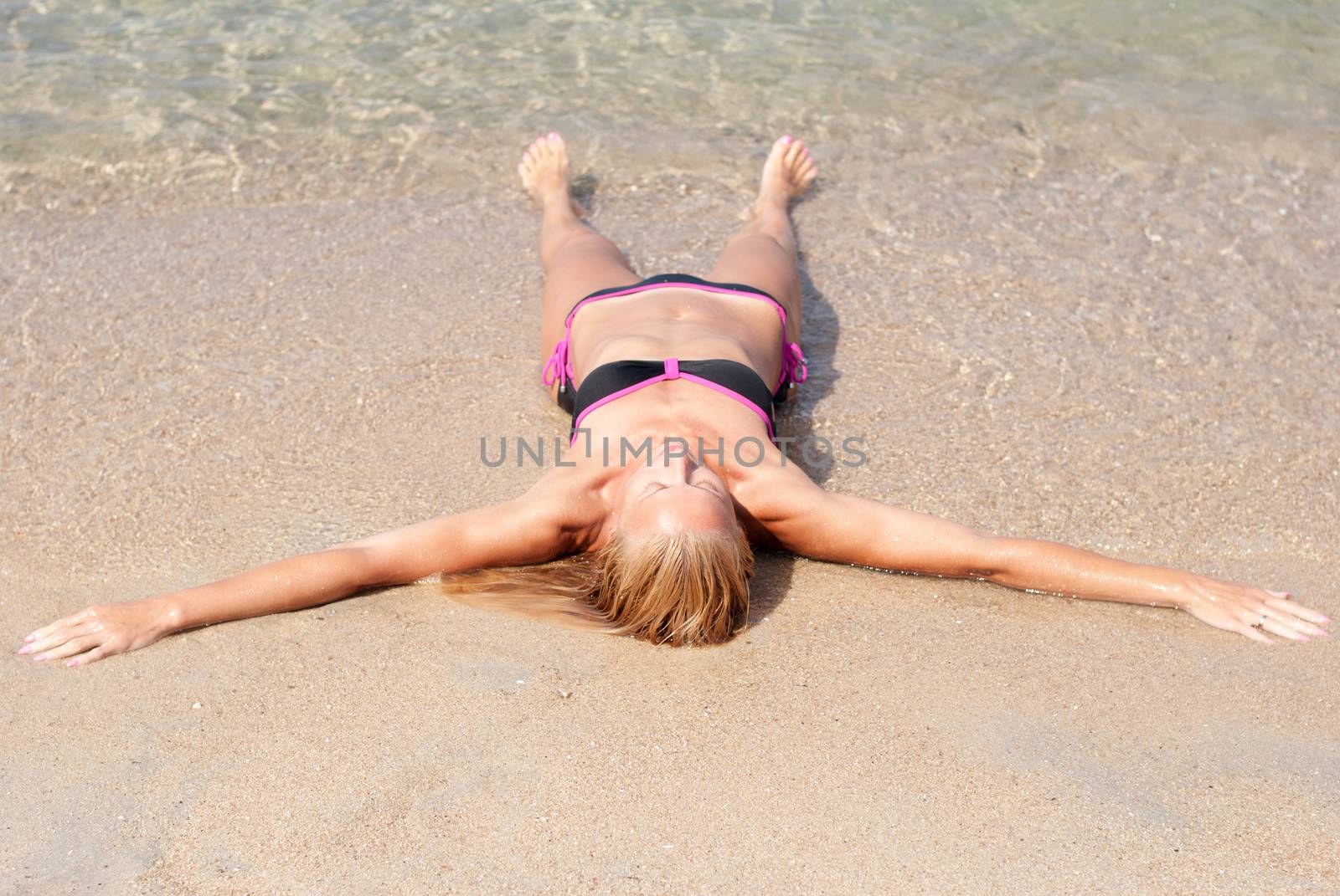 Beautiful young woman relaxing at beach