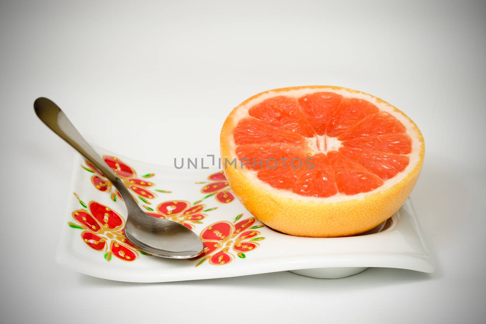 Halved red grapefruit on beautiful tray