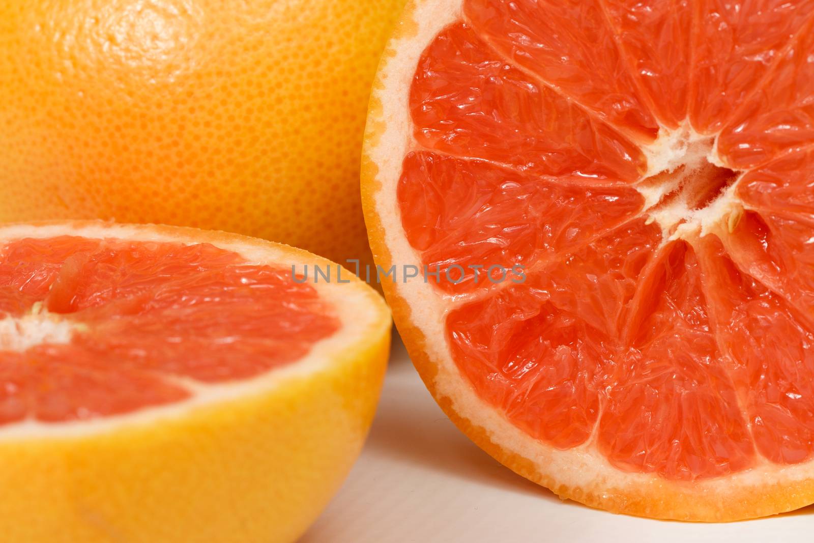 Halved red grapefruit by MilanMarkovic78