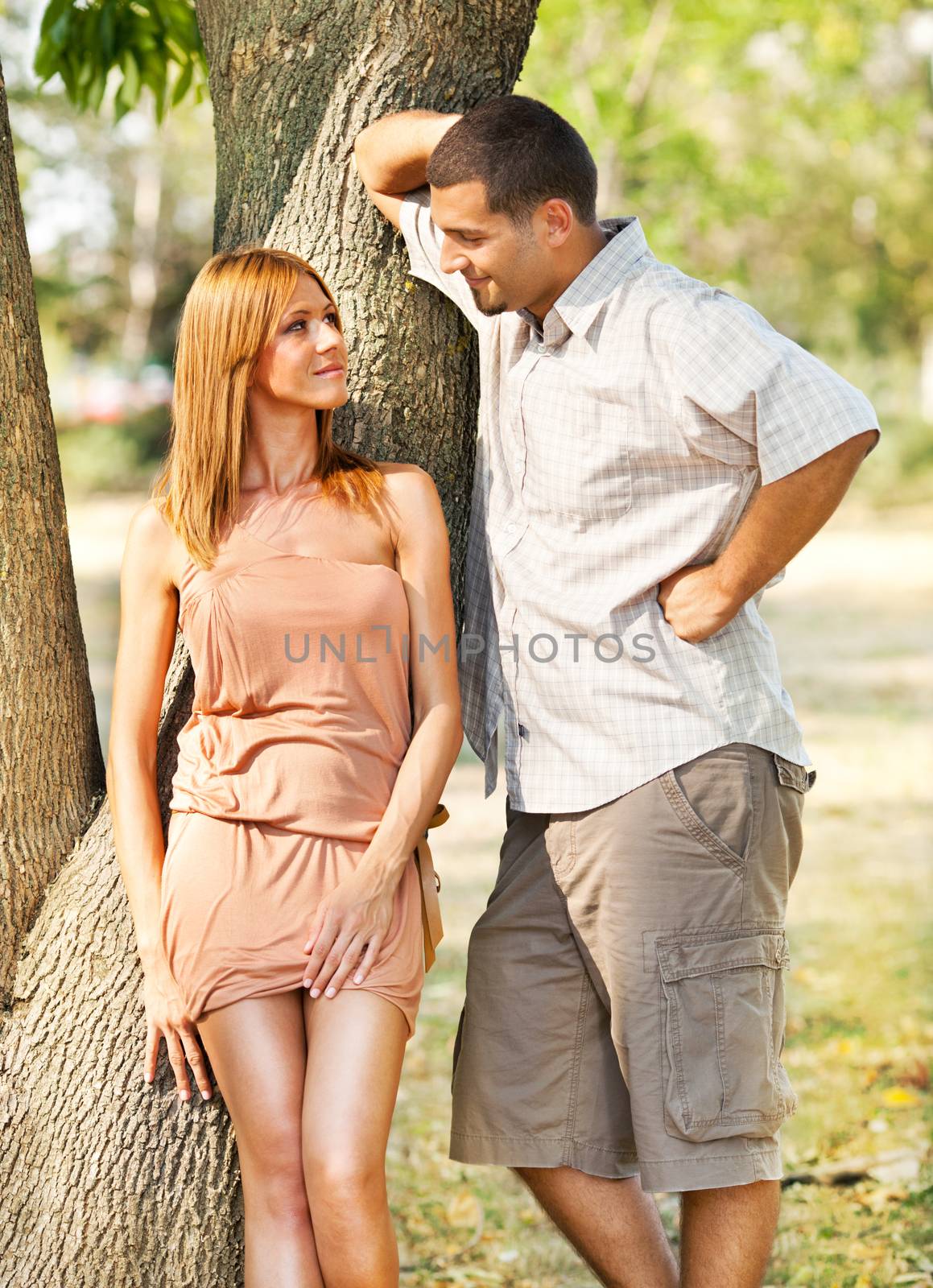 Two young people flirting in the nature