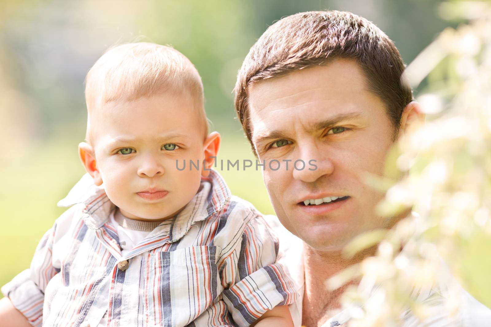 Father and son portrait in the nature