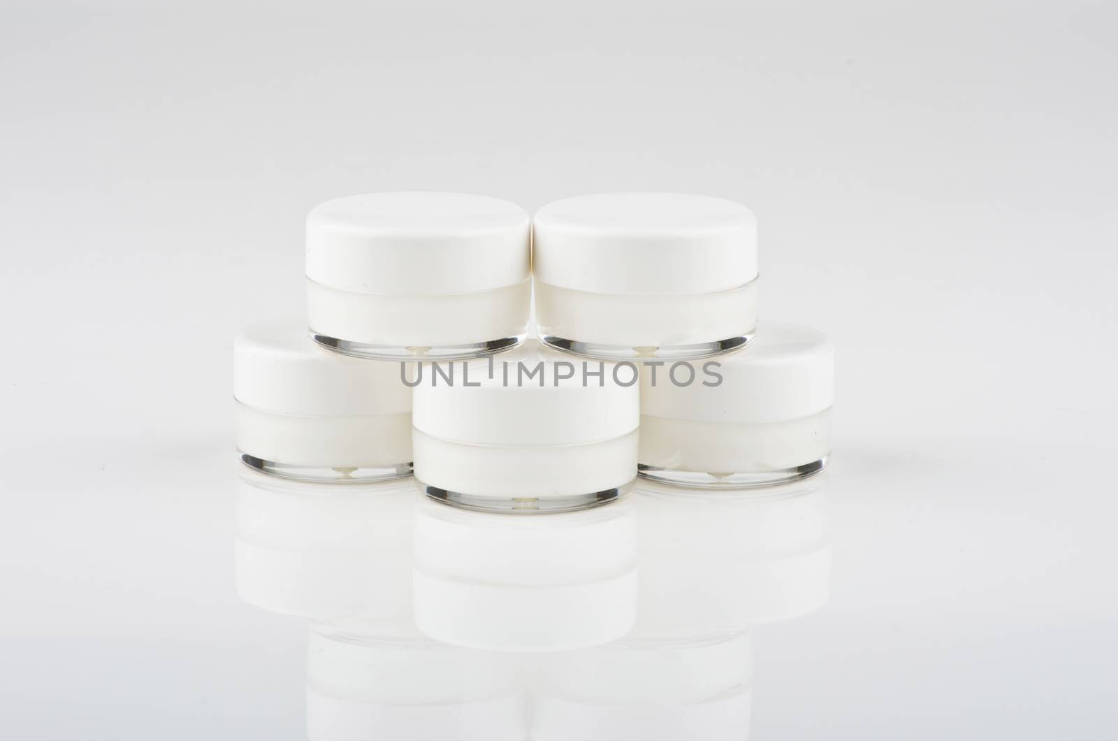 Blank white facial cream jar isolate on white background by dolnikow