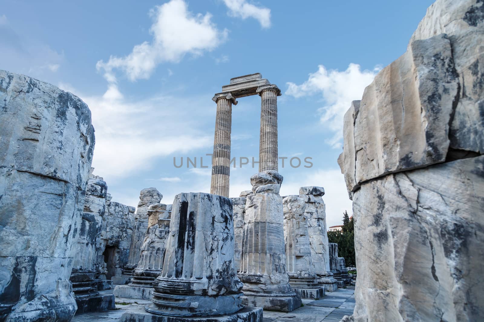 View of Apollon Temple in Didyma Ancient City in Aydın Turkey, on cloudy blue sky bakcground.