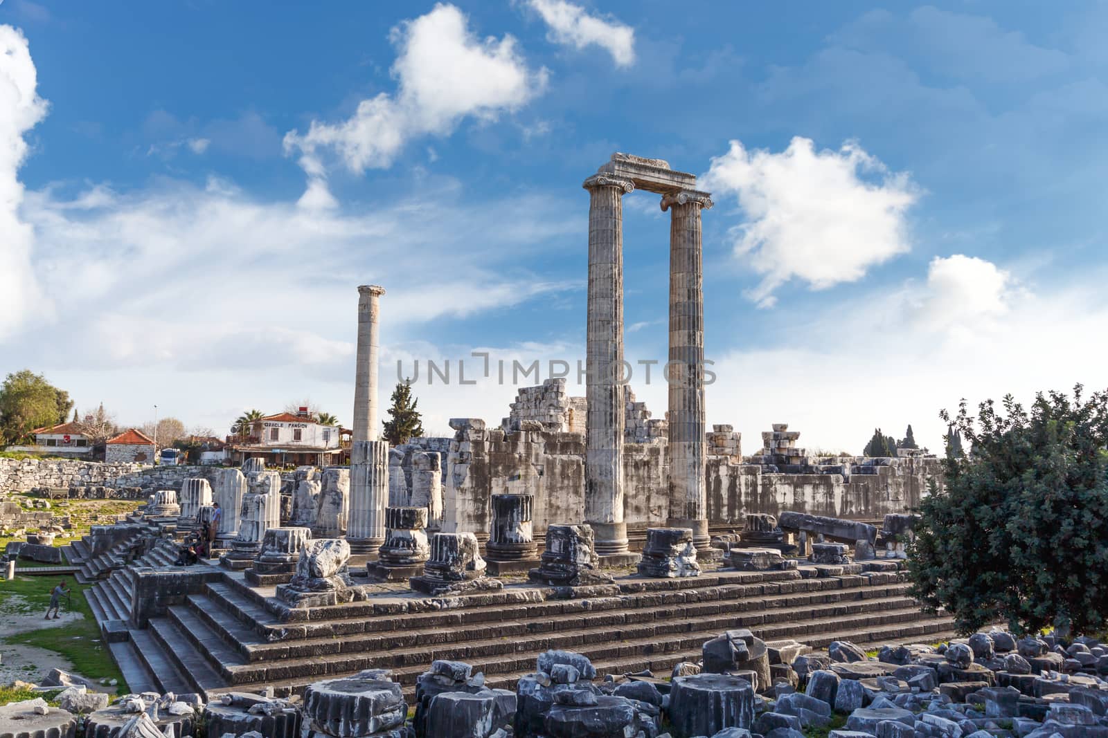 General view of ruins of Apollon Temple in Didyma Ancient City, on cloudy blue sky background.