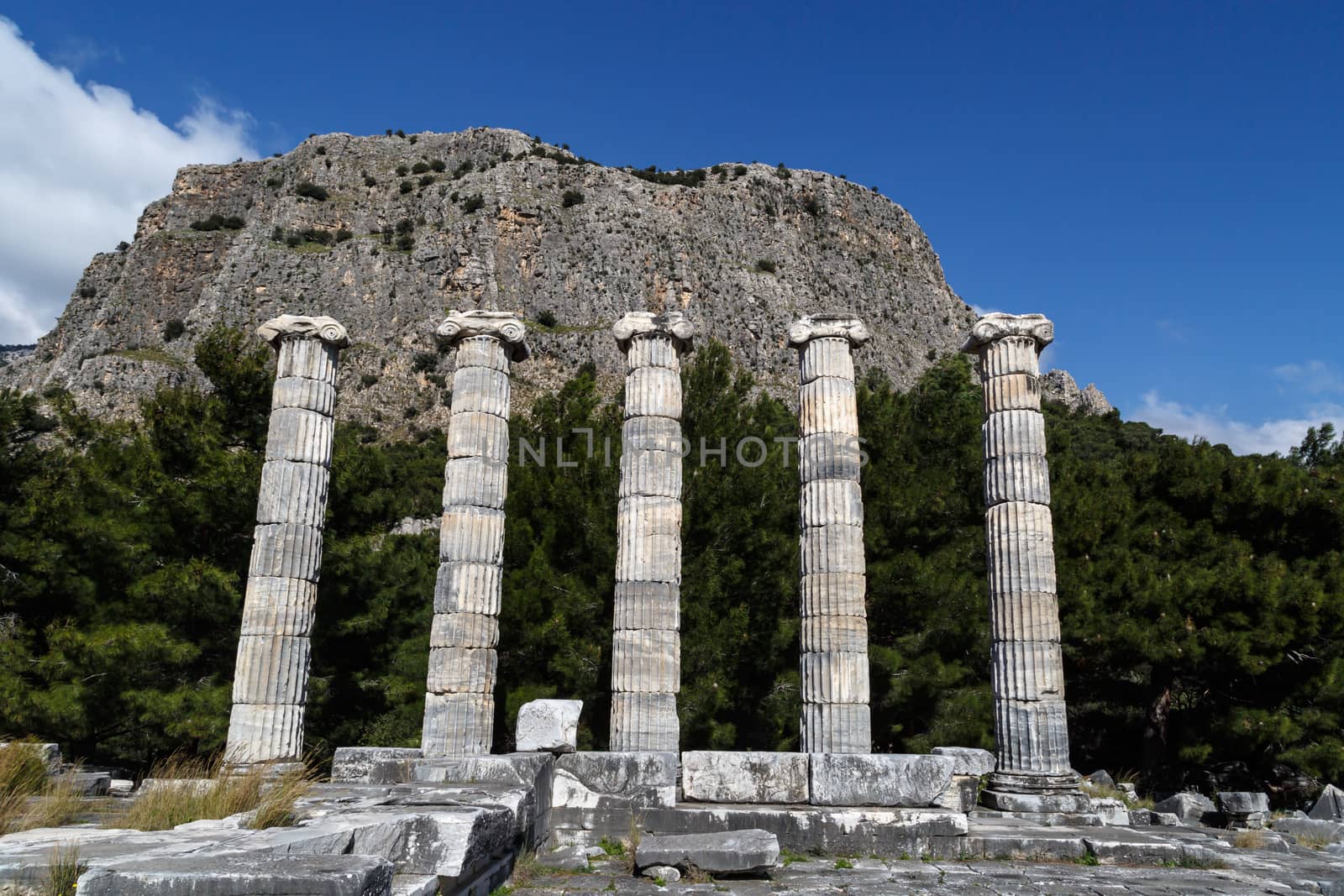 General temple view of Priene Ancient City in Aydın, Turkey, on bright blue sky background.