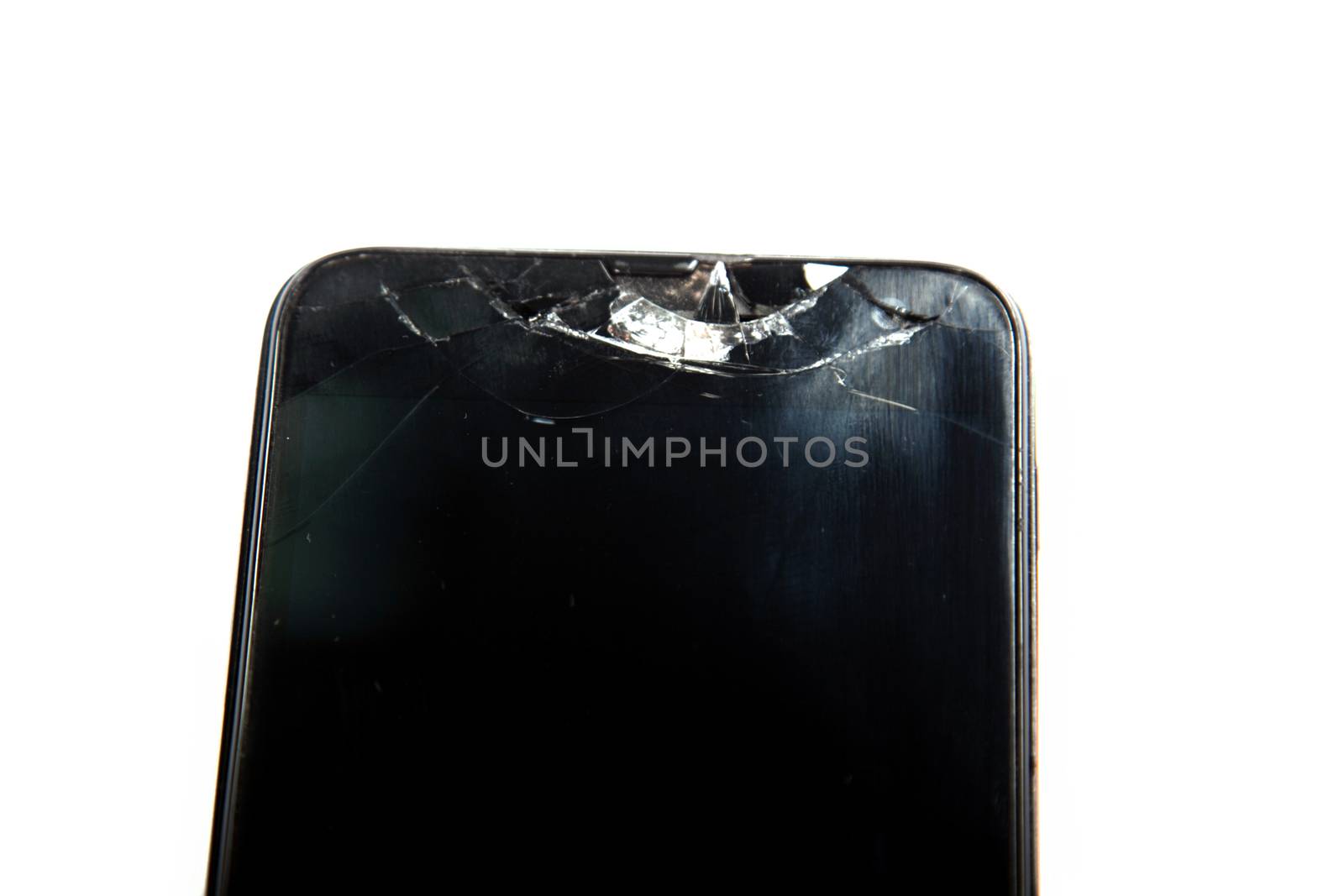 smashed the phone isolated on white background by traza