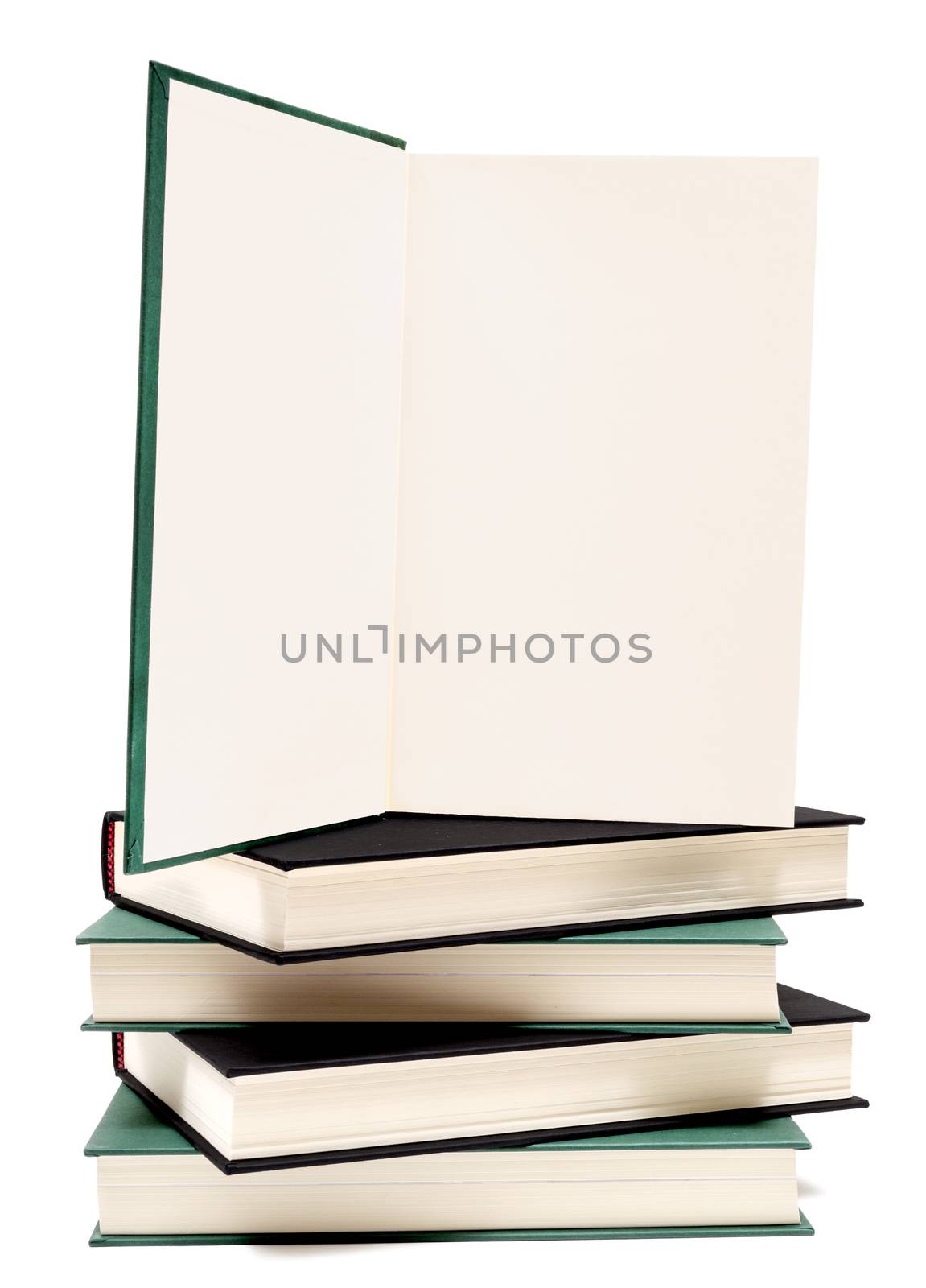 Opened book on stack of books.  Isolated on white.