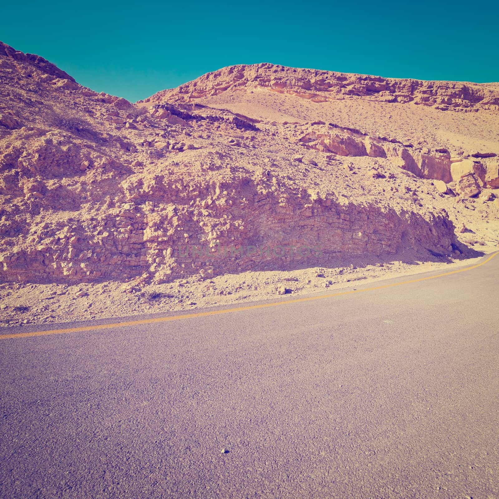 Asphalt Road above Grand Crater in Negev Desert, Retro Effect