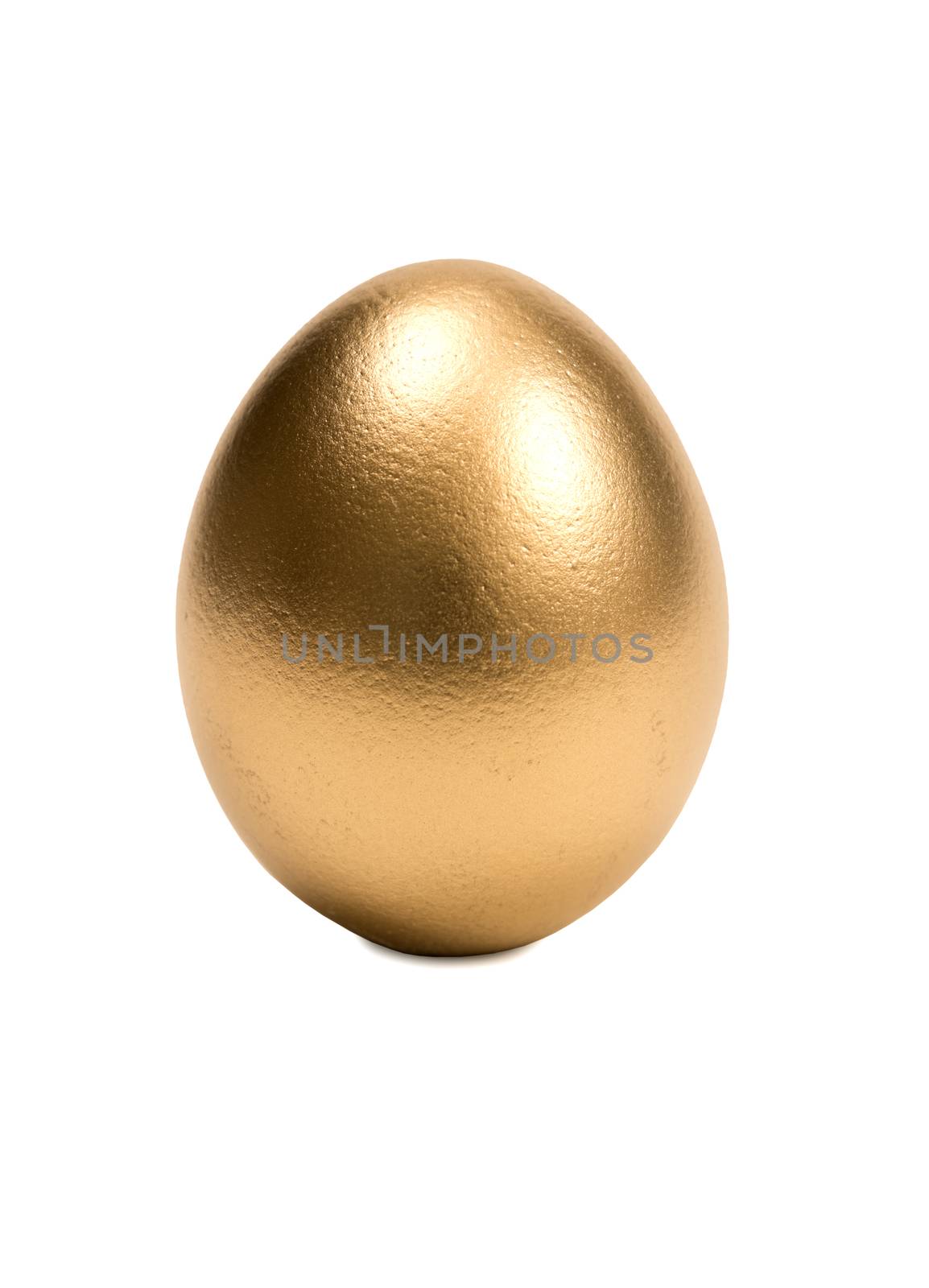 Close up shot of the perfect golden egg.  Isolated on a white background