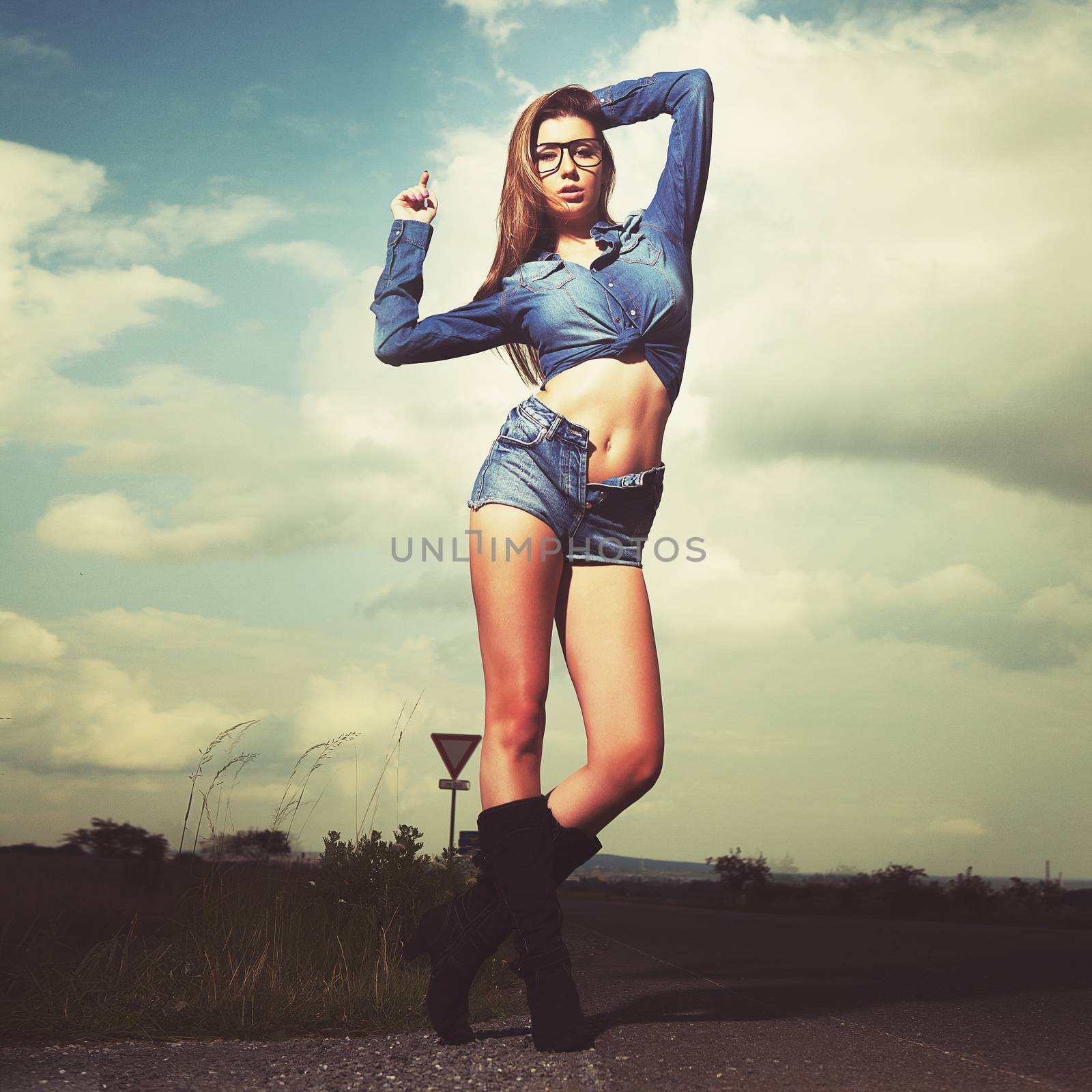 attractive brunette girl in jeans by fotoduki