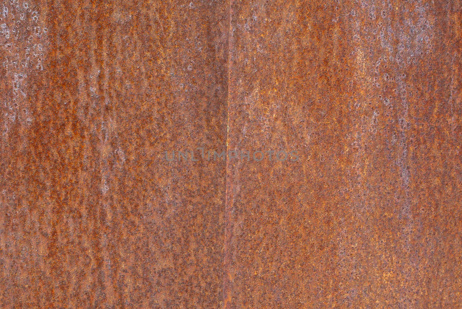 rusty iron surface covered with old chipped paint, which has long been influenced by different climatic conditions