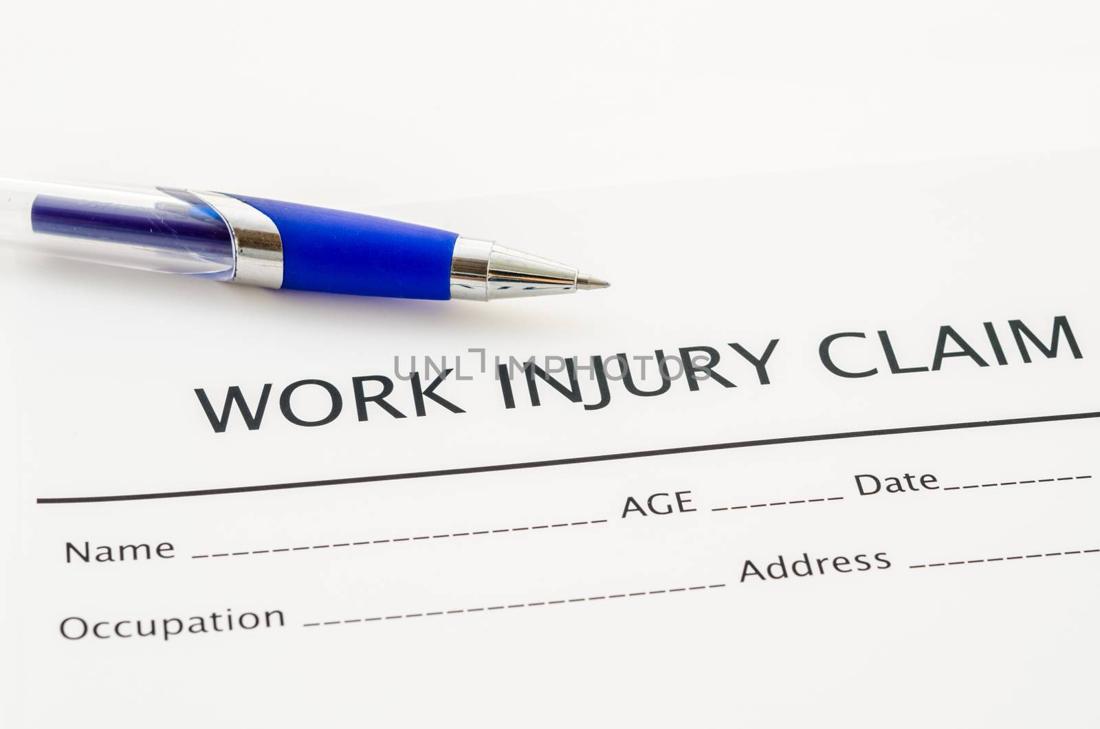 Claim form for an injury at work with pen. by Gamjai