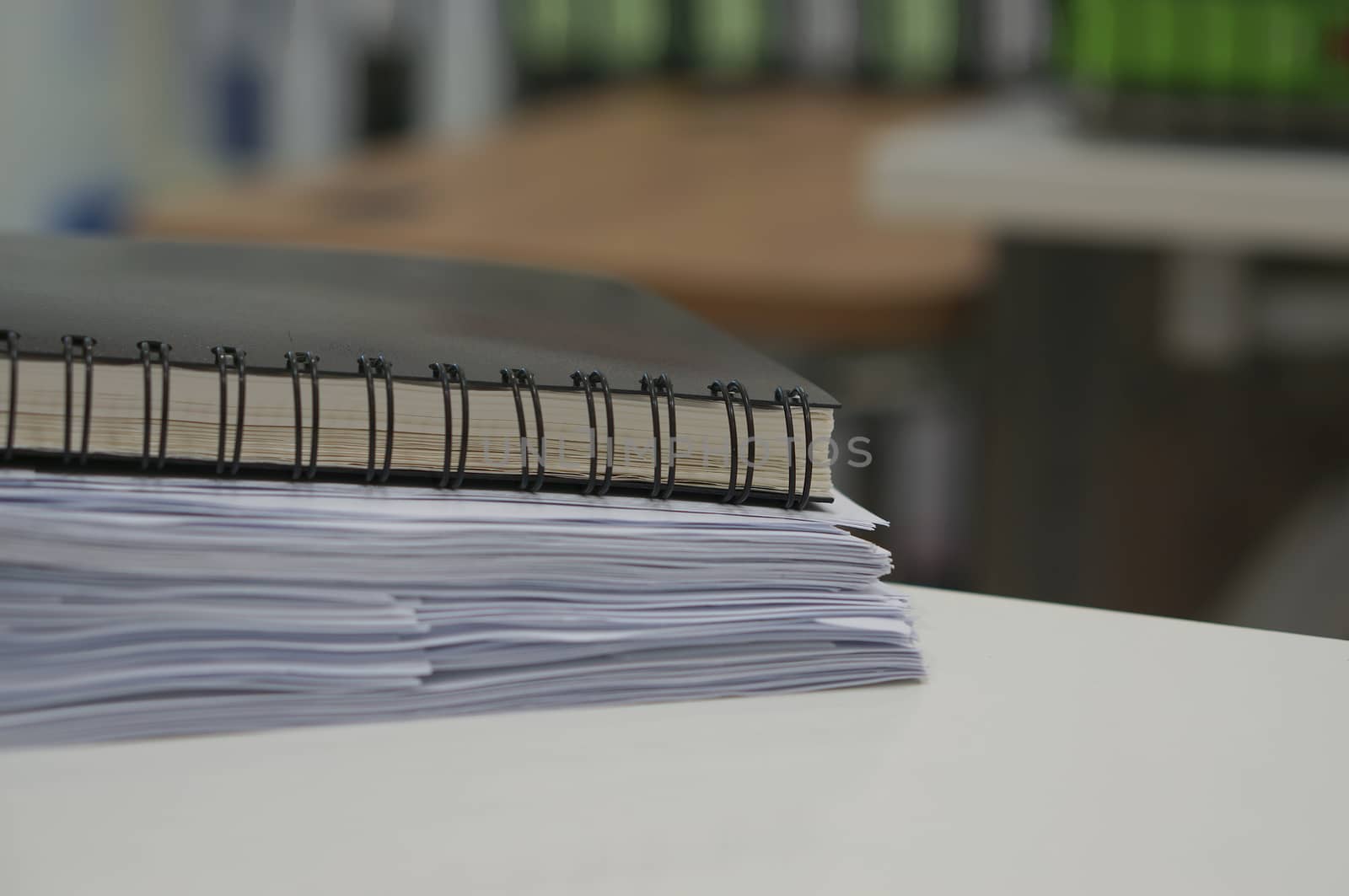 Black notebook and stack of data document  by ninun