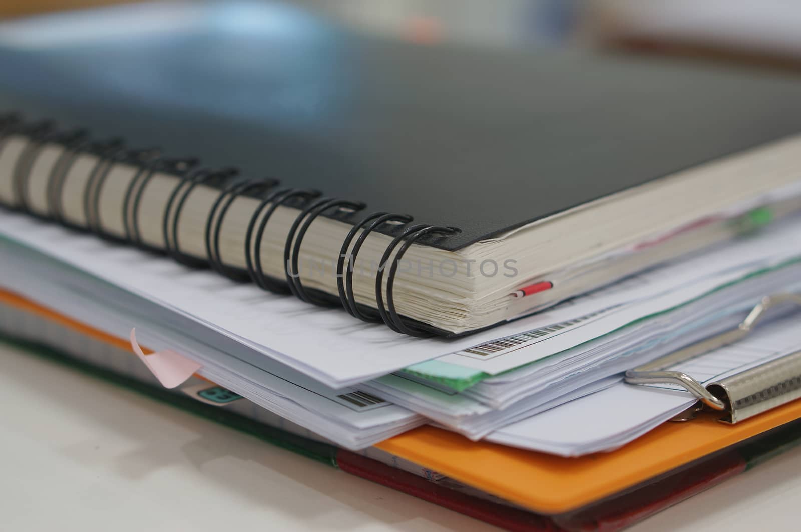 Stack of paperwork and notebook  by ninun