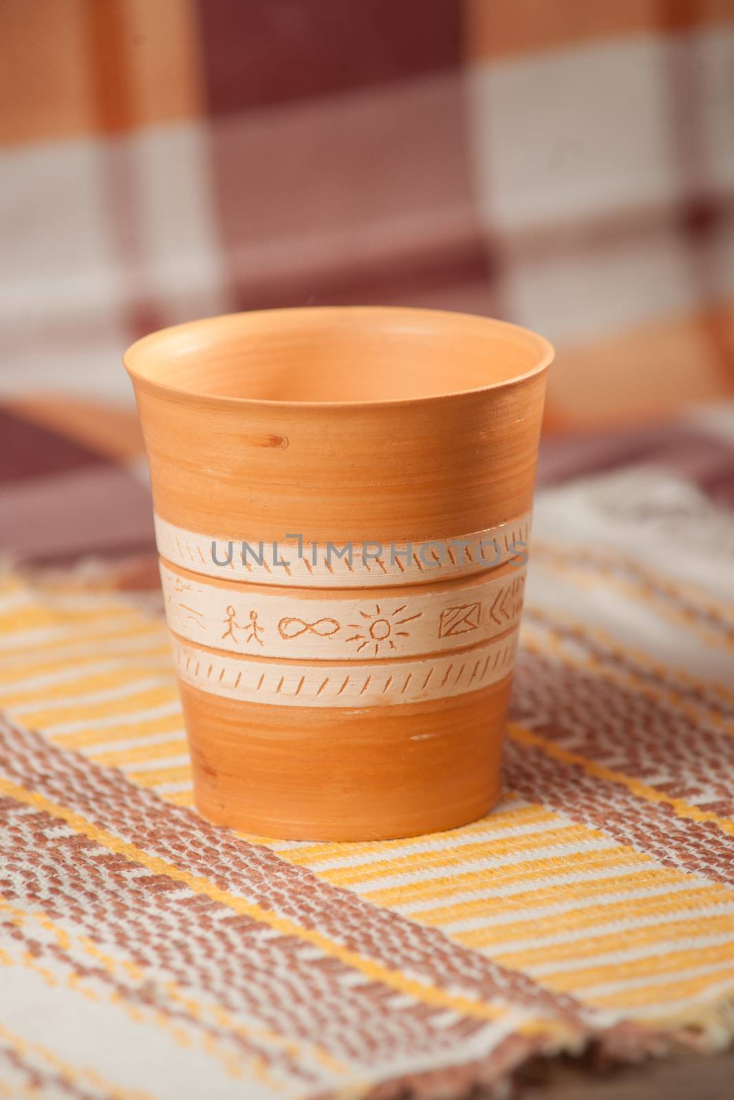 Traditional handcrafted mug on multycolor background. High resolution