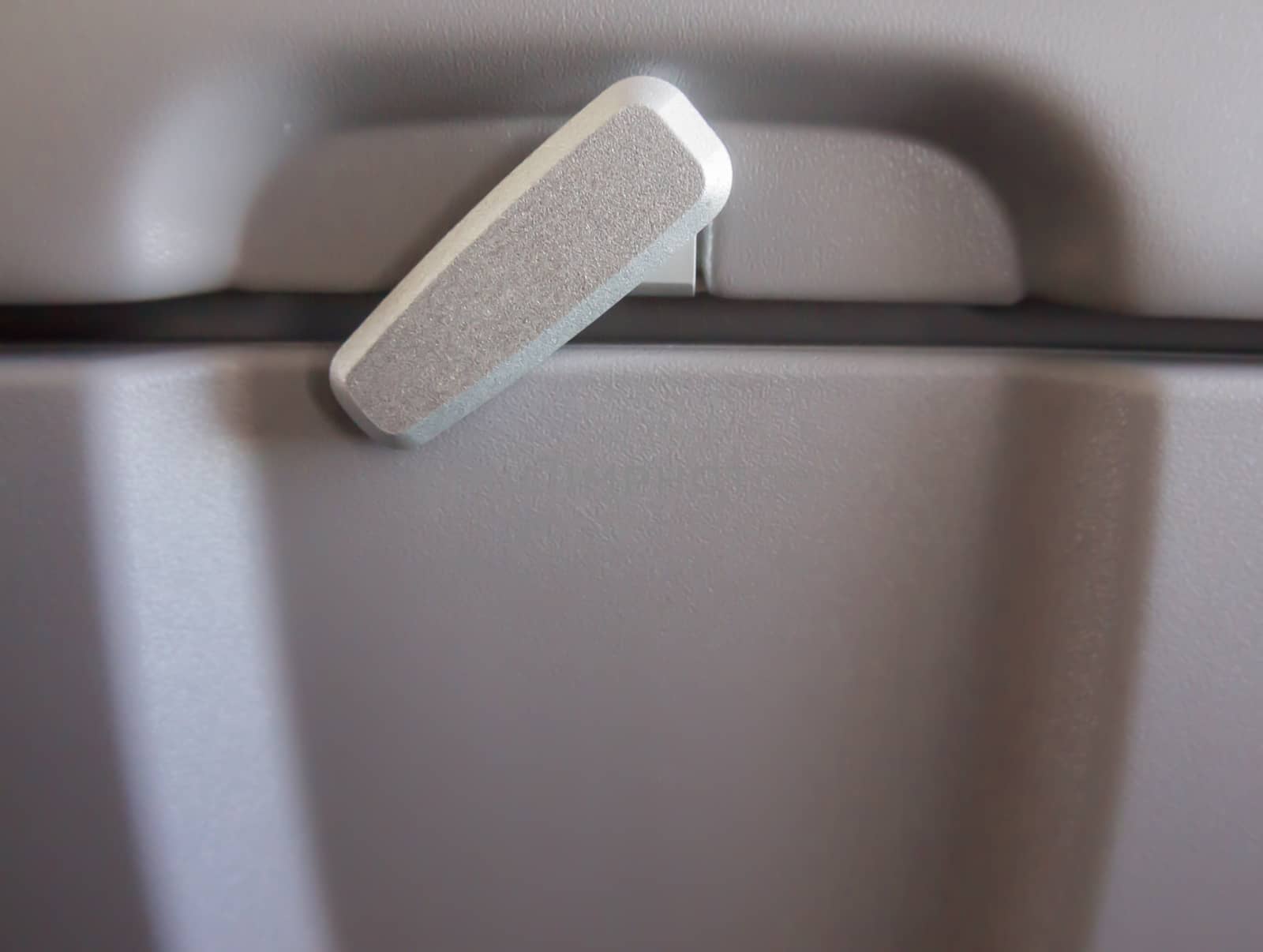 Locker of storage behind the passenger seat in the plane