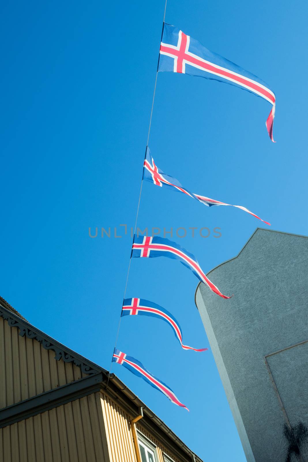 Iceland flags hanging on a wire in a city