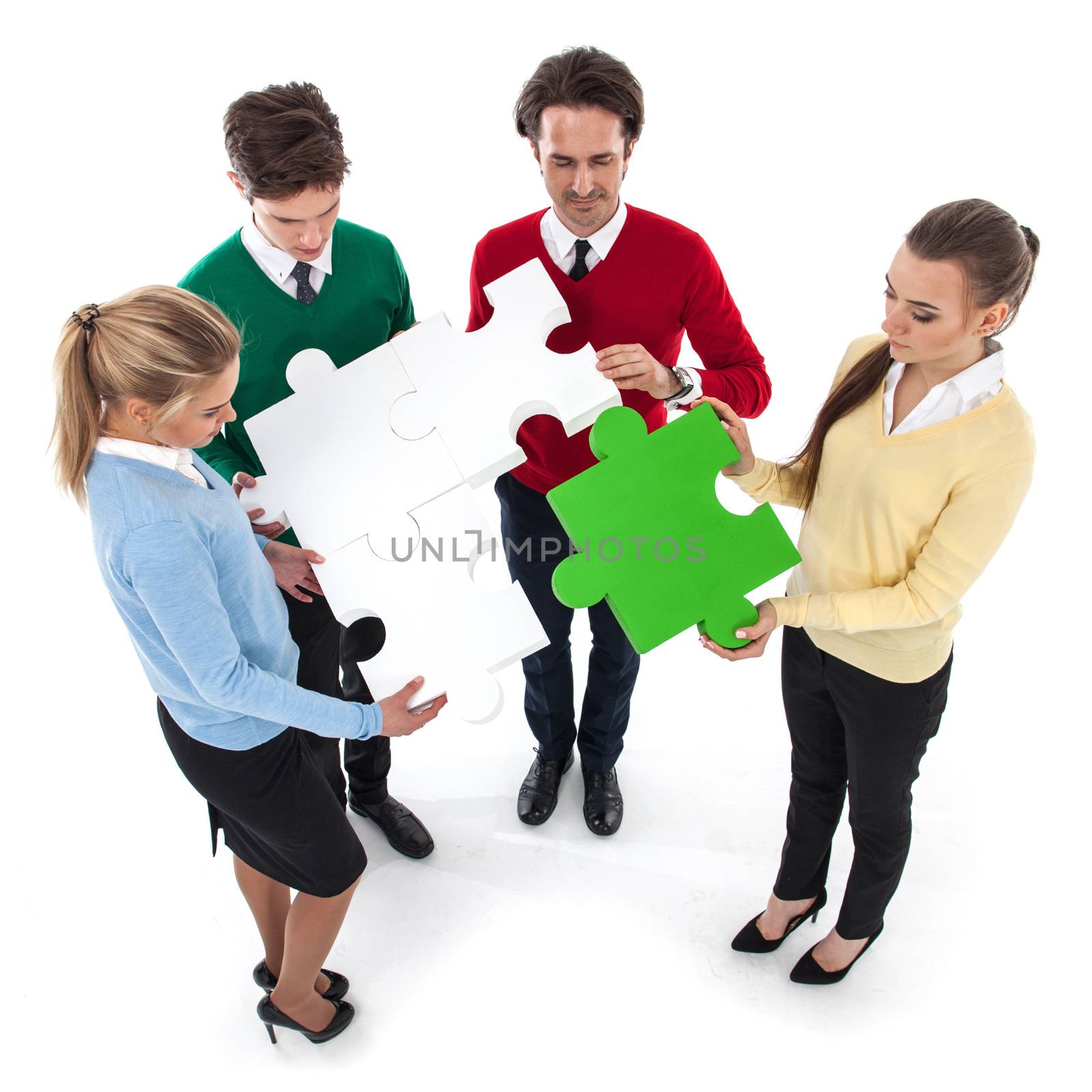 Group of people assembling jigsaw puzzle isolated on white background