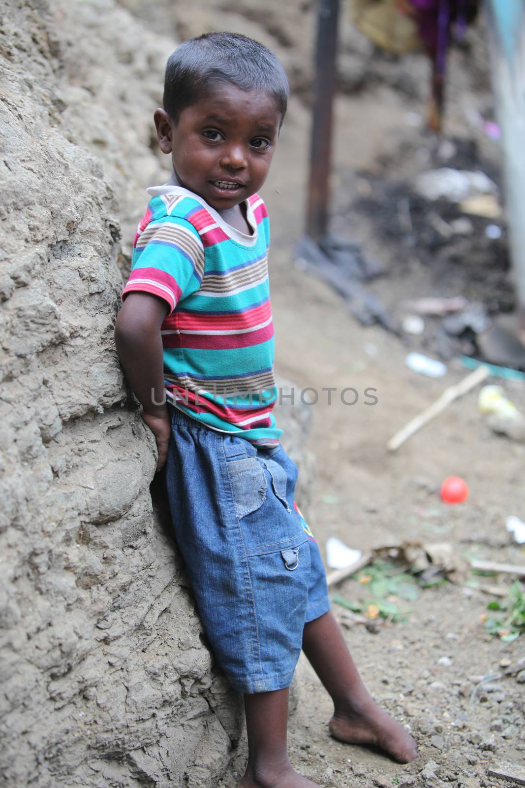 Pune, India - July 16, 2015: A poor Indian boy standing at a con by thefinalmiracle