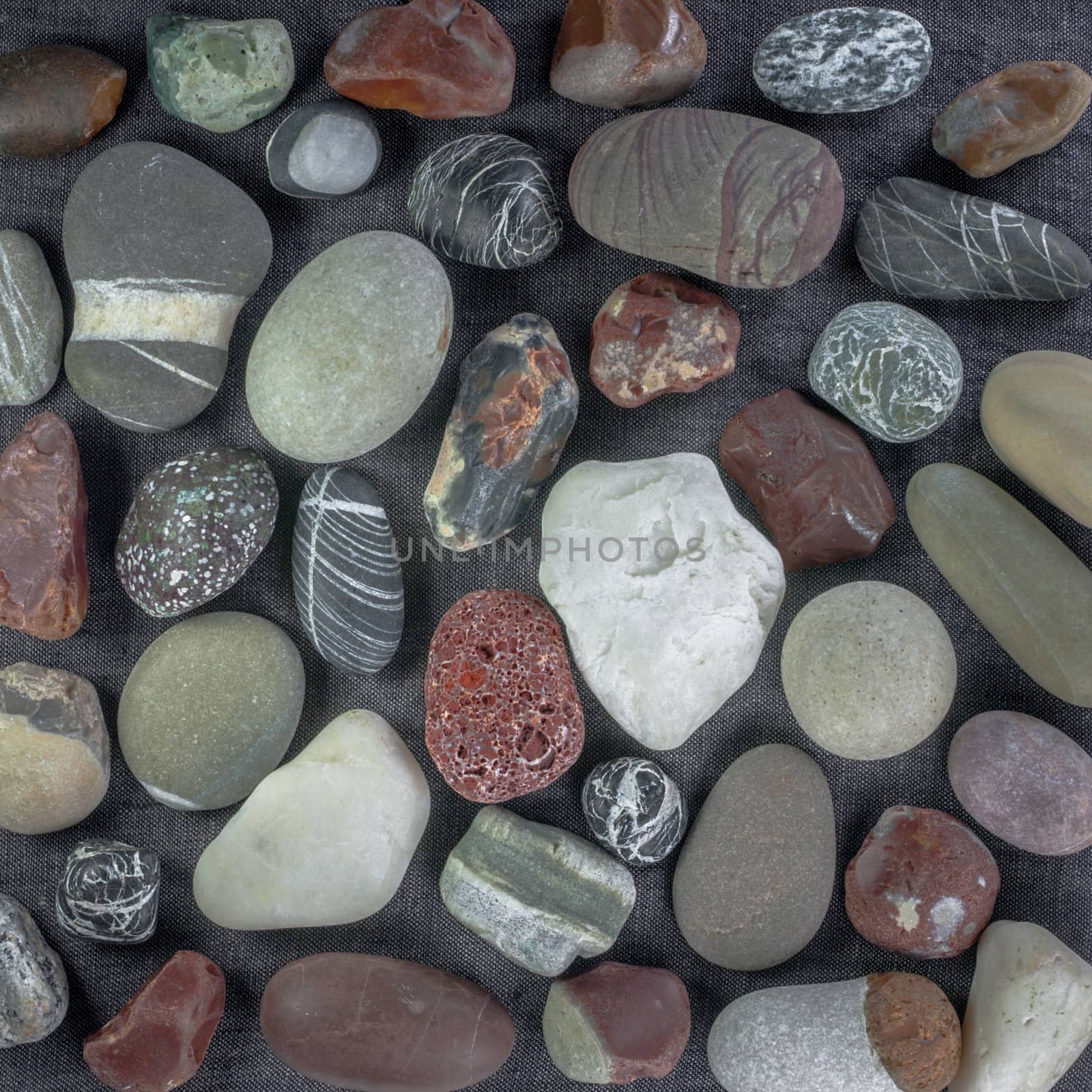 sea stones on gray canvas background by uvisni