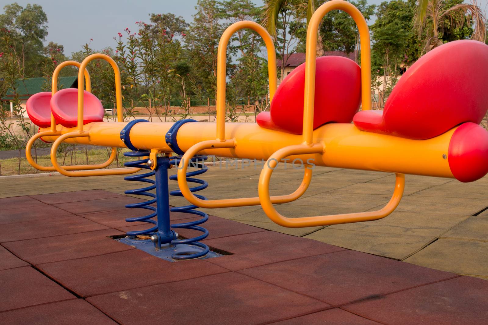 Modern colorful children playground in public park Children playground,seesaw by N_u_T