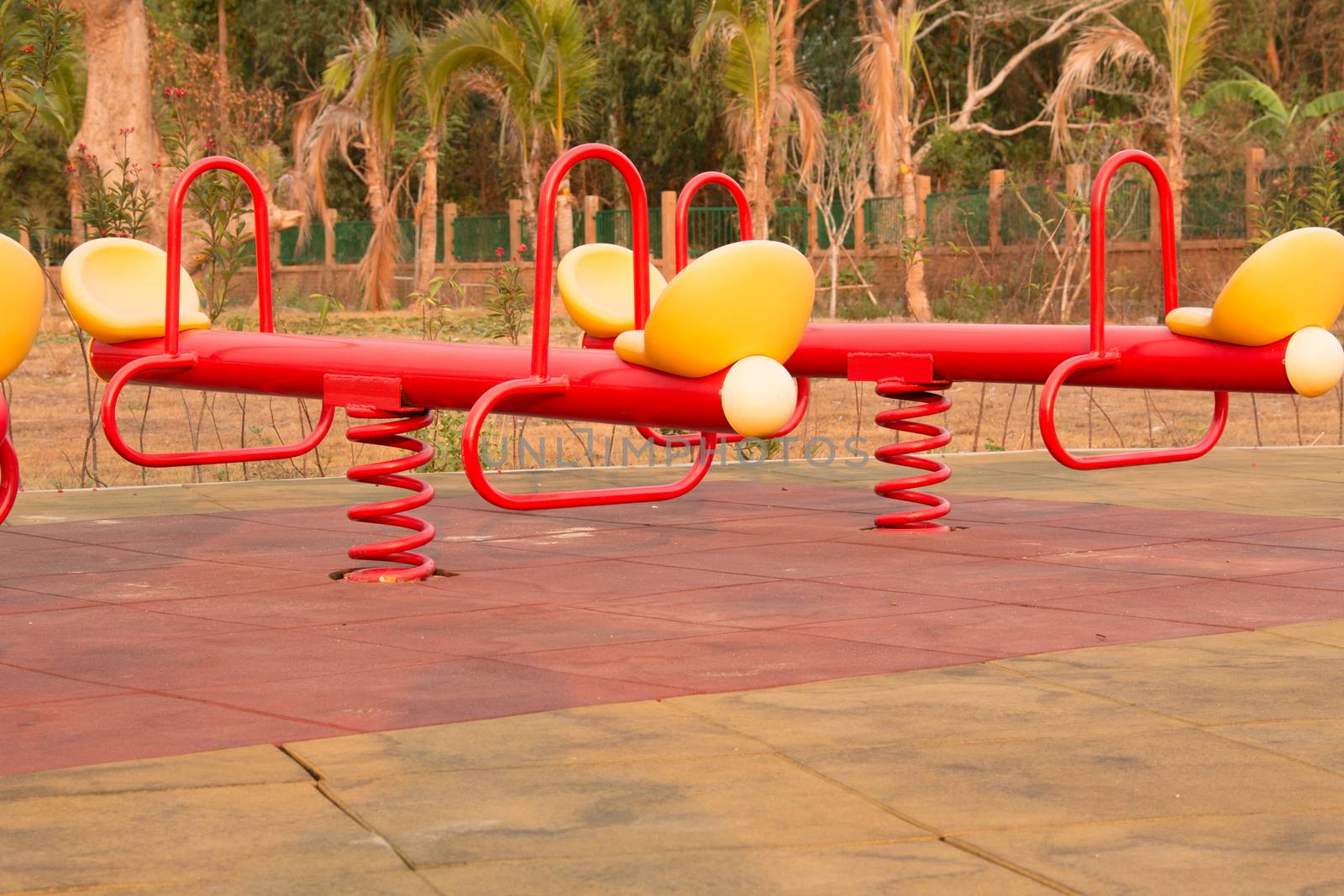 Modern colorful children playground in public park Children playground,seesaw by N_u_T