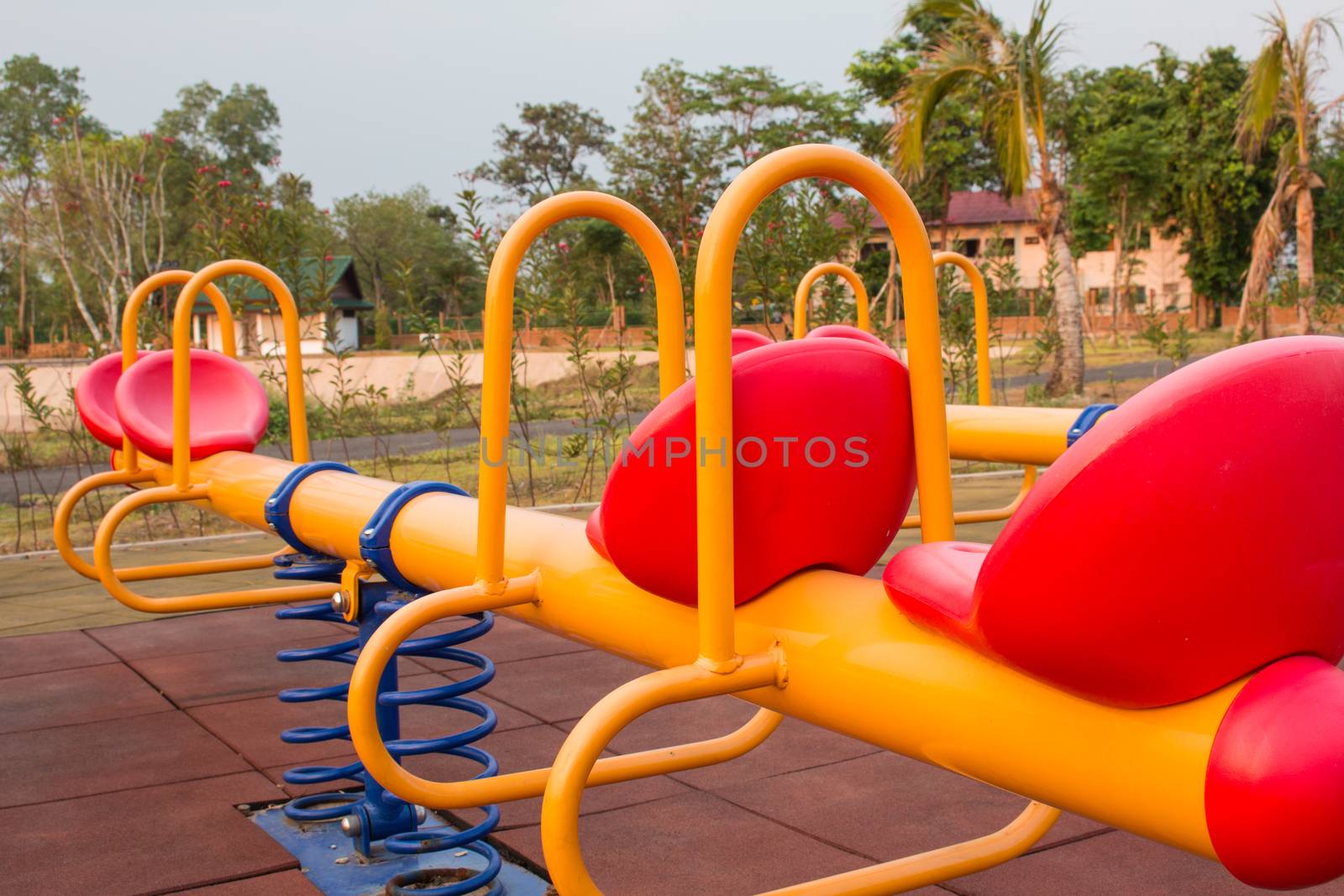 Modern colorful children playground in public park Children playground,seesaw by N_u_T