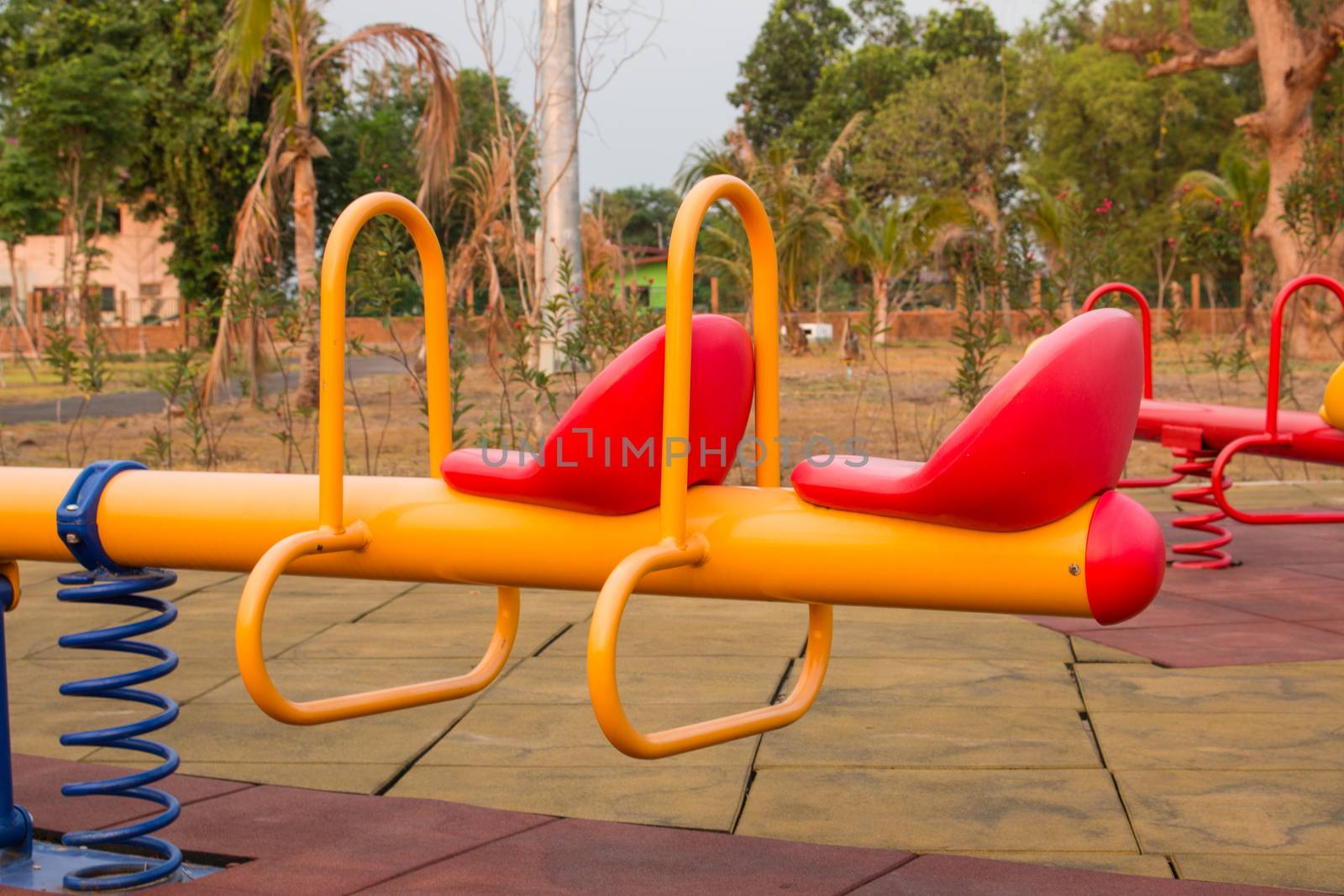 Modern colorful children playground in public park Children playground,seesaw by N_u_T