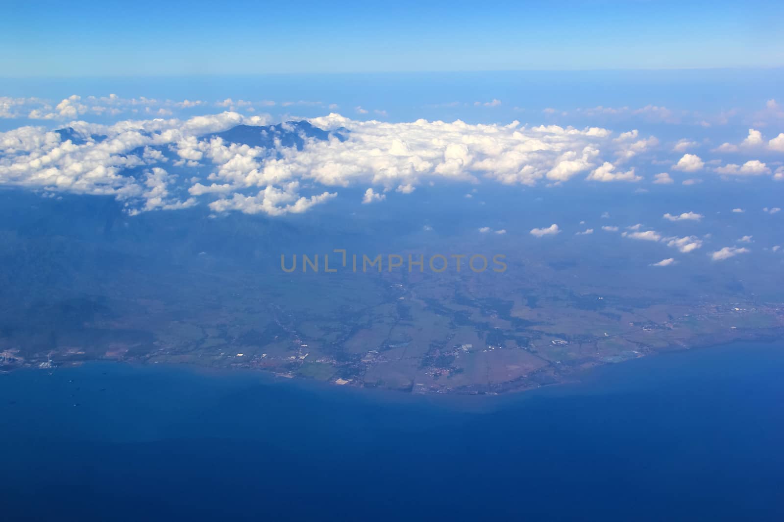 Soft clouds over view from airplane flying