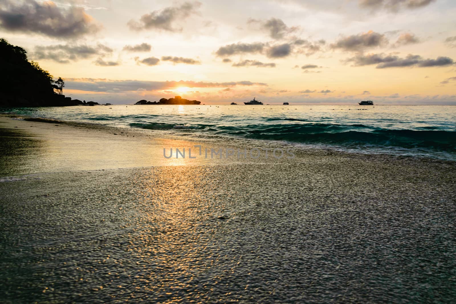 Beautiful landscape morning sky over the sea and beach at Honeymoon Bay during sunrise is a famous attractions for diving on Miang island in Mu Koh Similan National Park, Phang Nga Province, Thailand