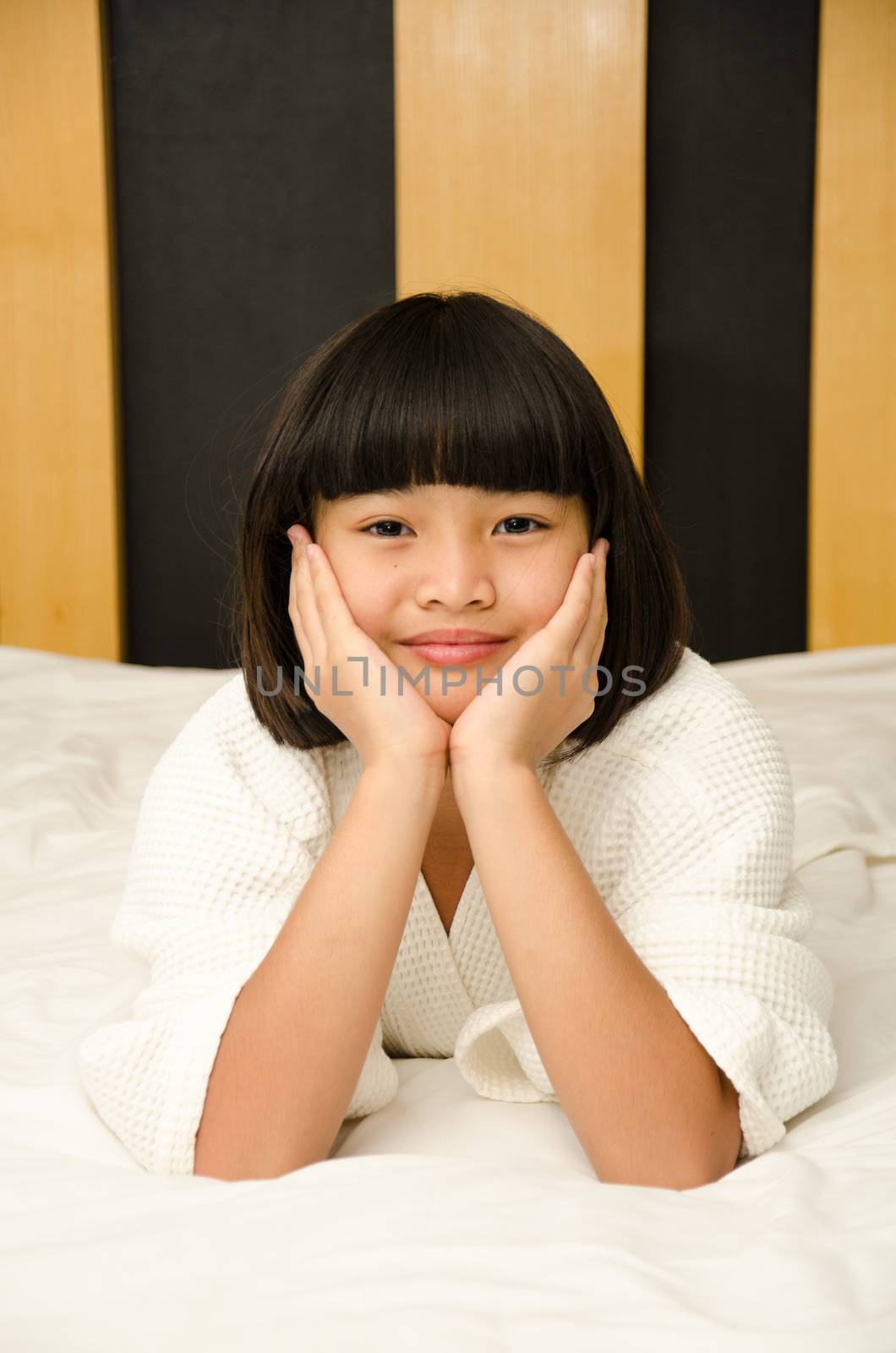 Adorable girl waked up. by chatchai