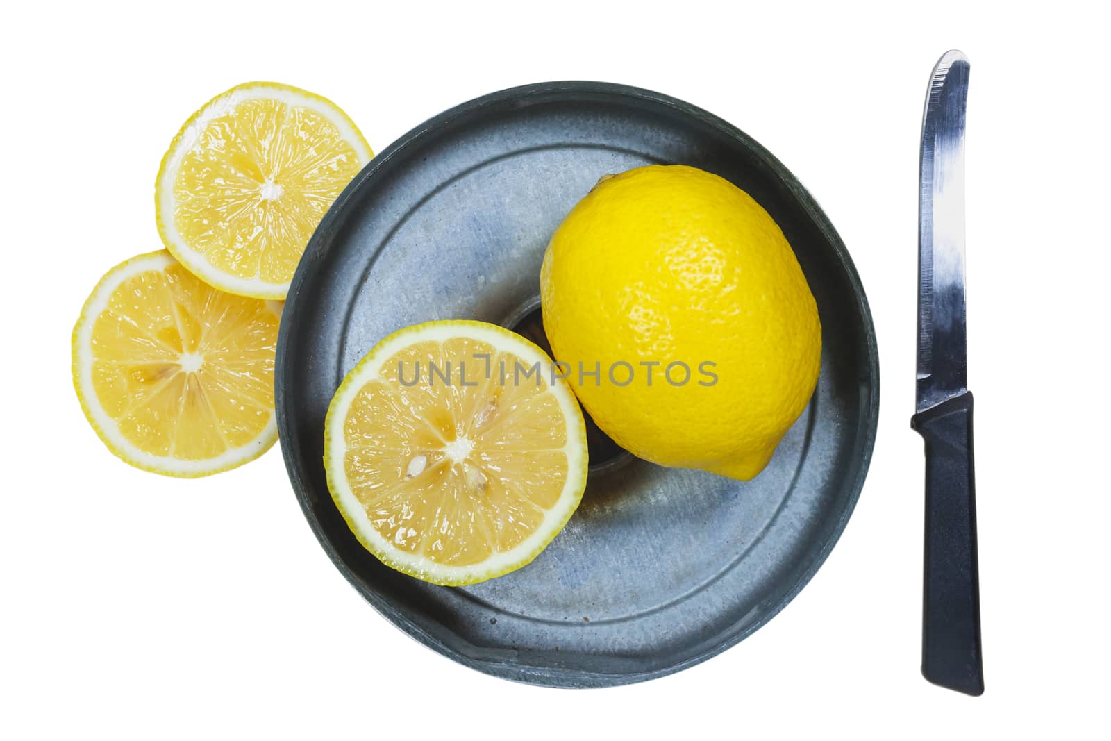 Sliced lemons with knife isolated on white background by nopparats