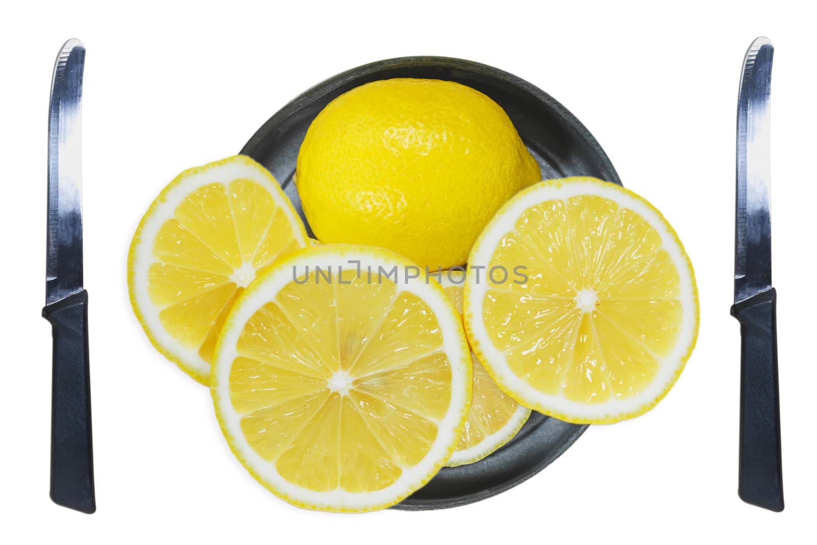 Sliced lemons with knife isolated on white background.