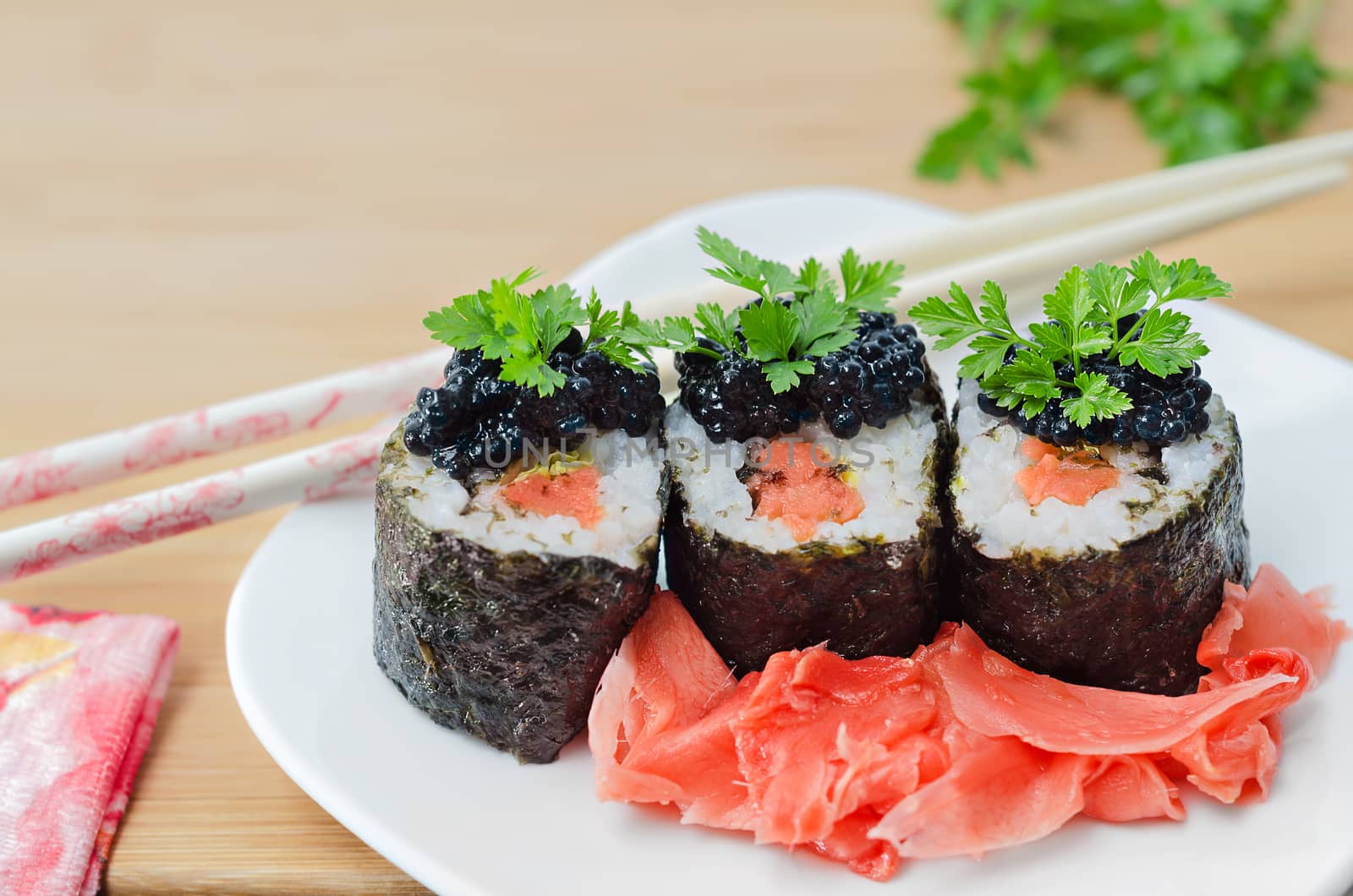 Rolls with salmon, caviar and pickled ginger by Gaina