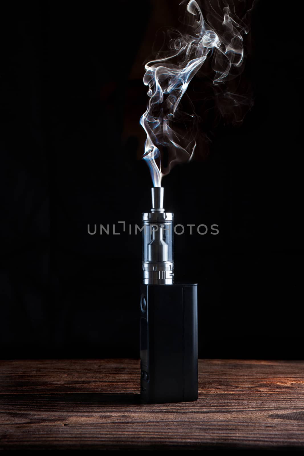 electronic cigarette over a dark background close up