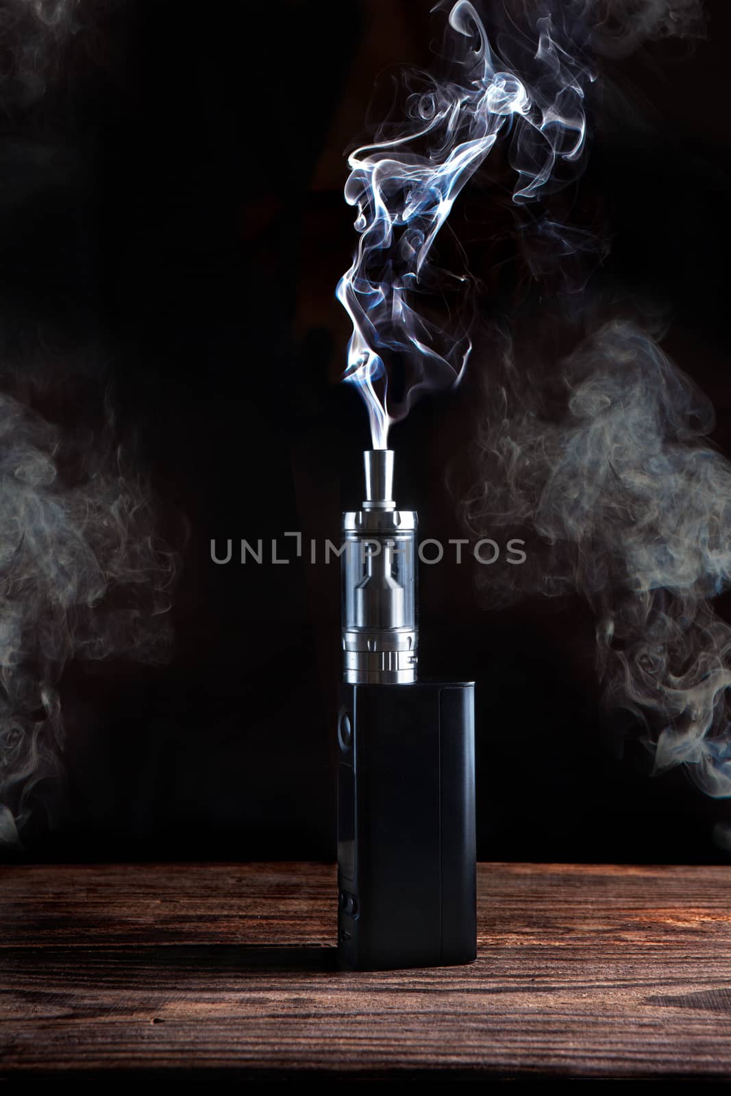 electronic cigarette over a dark background close up