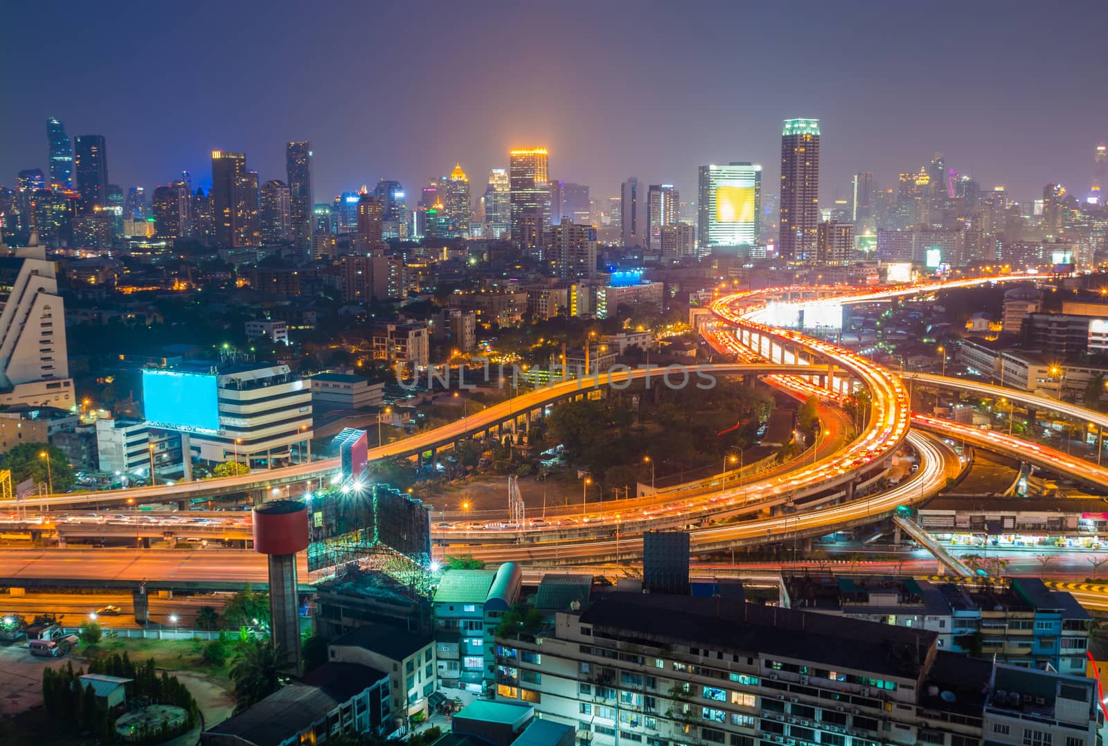 Aerial view of Bangkok city downtown background, highway interchanged at Night