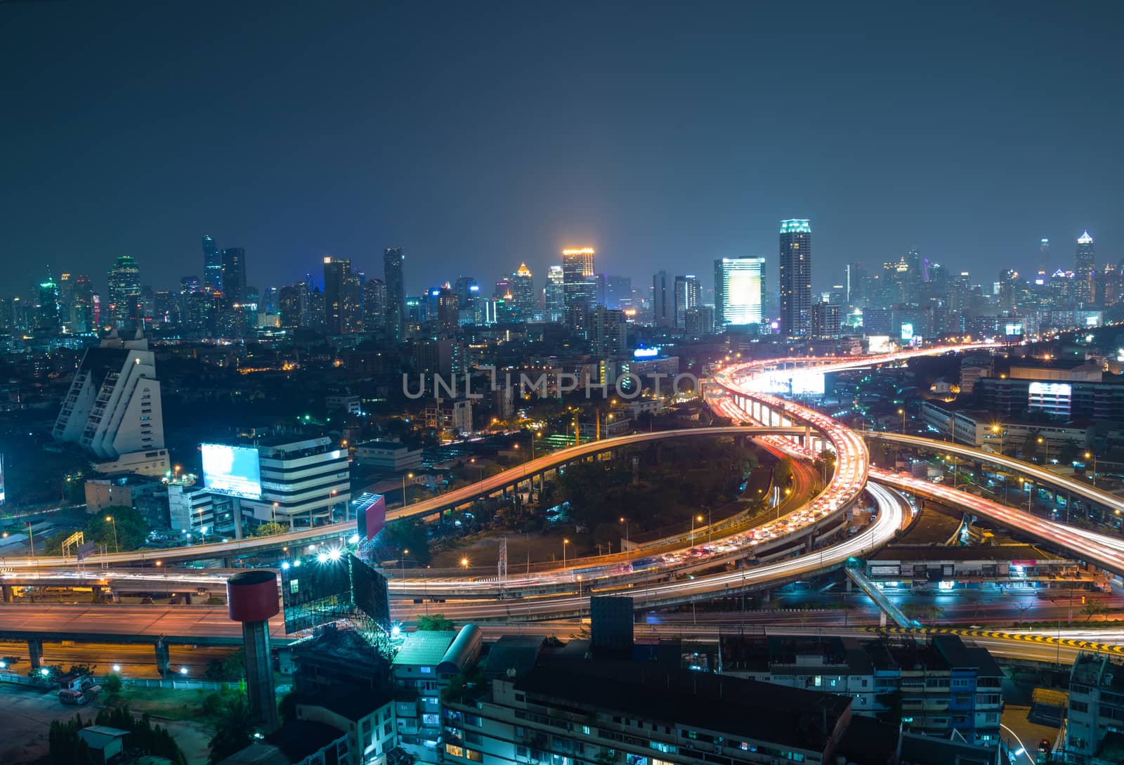 Aerial view of Bangkok city downtown background, highway interchanged at Night