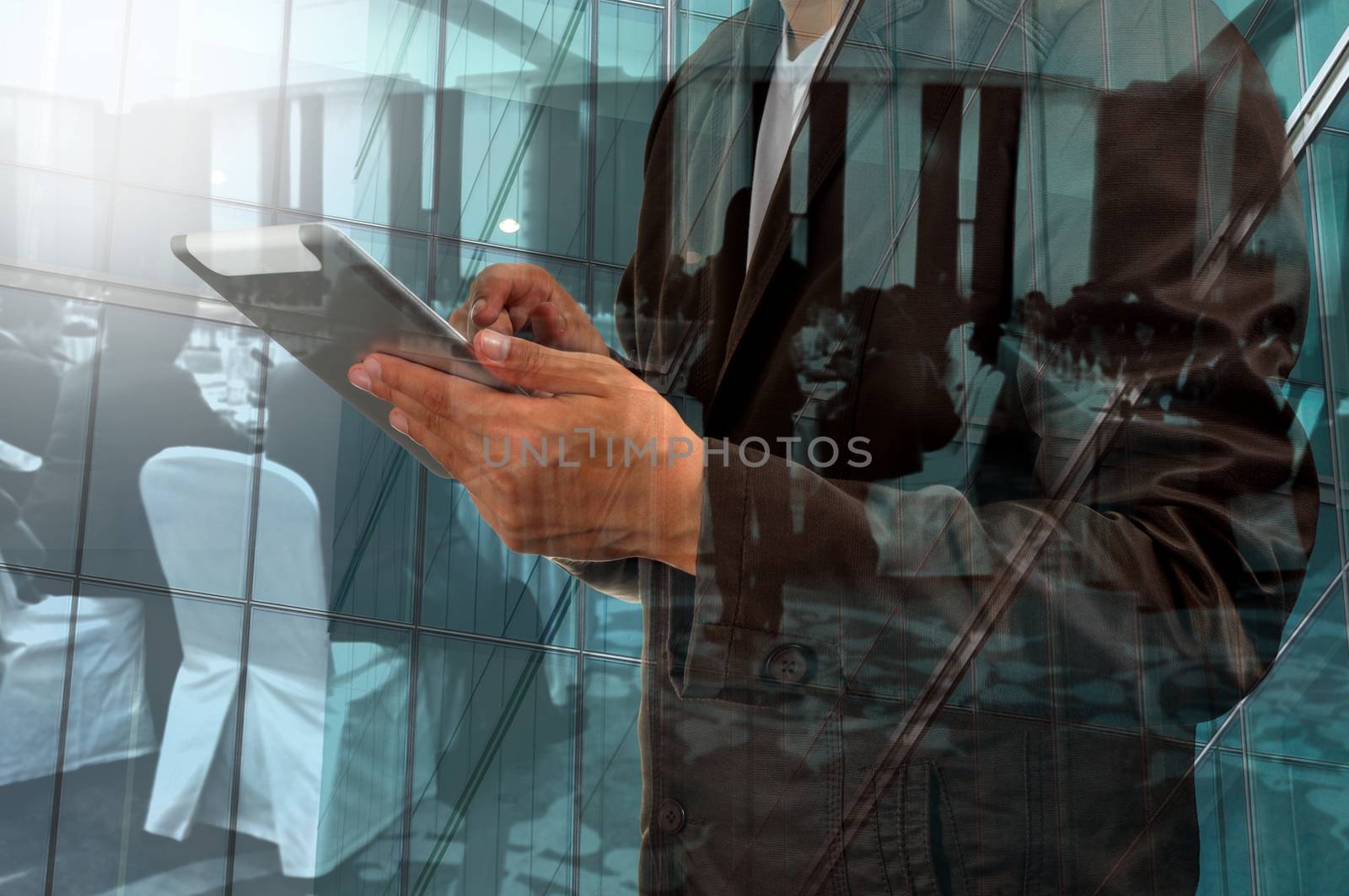 Double Exposure of Businessman use Tablet and Business Meeting or Seminar in Conference Hall