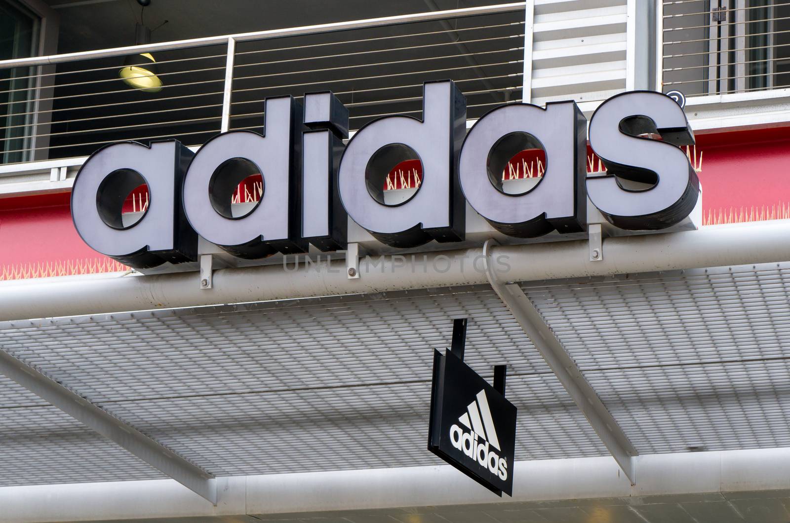 SANTA MONICA, CA/USA - MAY 12, 2016: Adidas retail store exterior and logo. Adidas is a German multinational corporation that designs and manufactures sports shoes, clothing and accessories.
