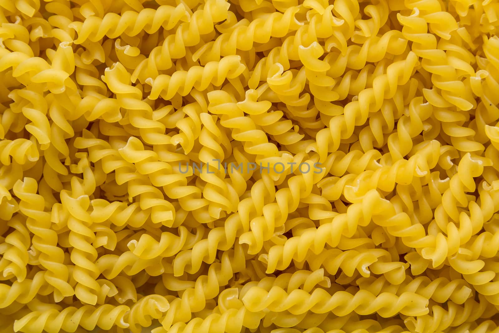 dry curly egg noodles close-up background
