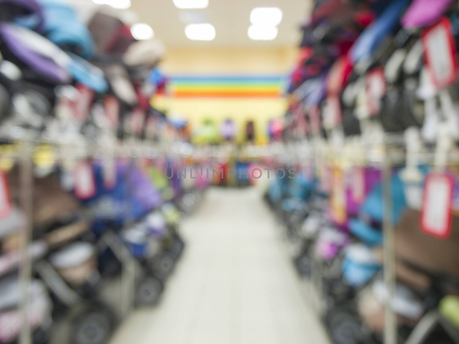 Blurred of kids strollers store background with bokhe