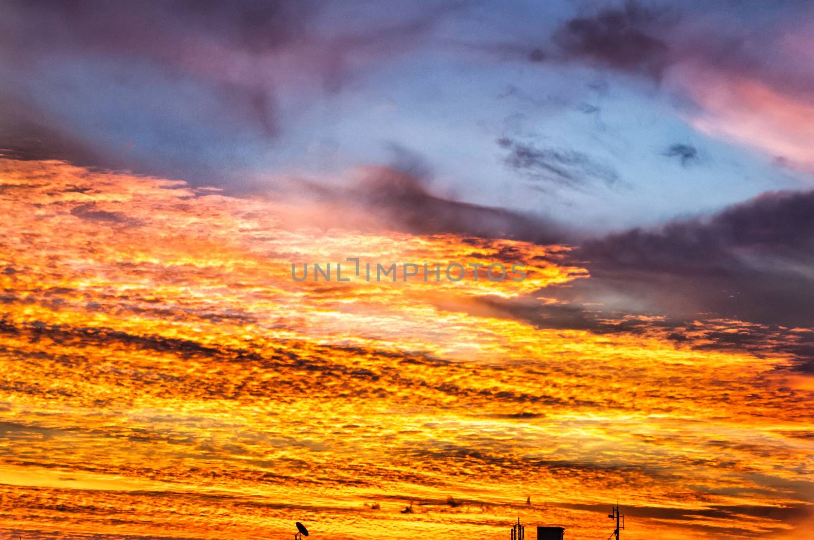 Sunset / sunrise with antennas, clouds and atmospheric effect