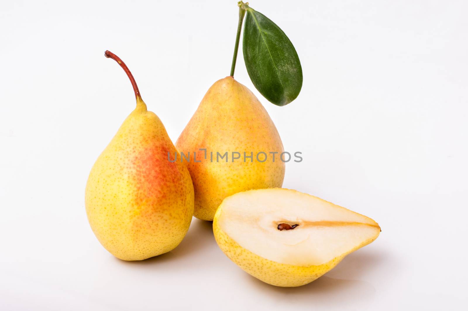 Yellow pears isolated on white background by mitakag