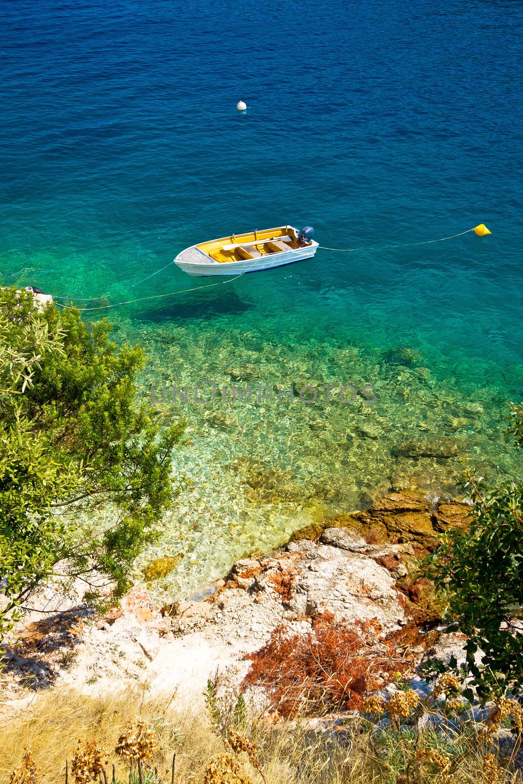 Lonely boat on idyllic beach by xbrchx