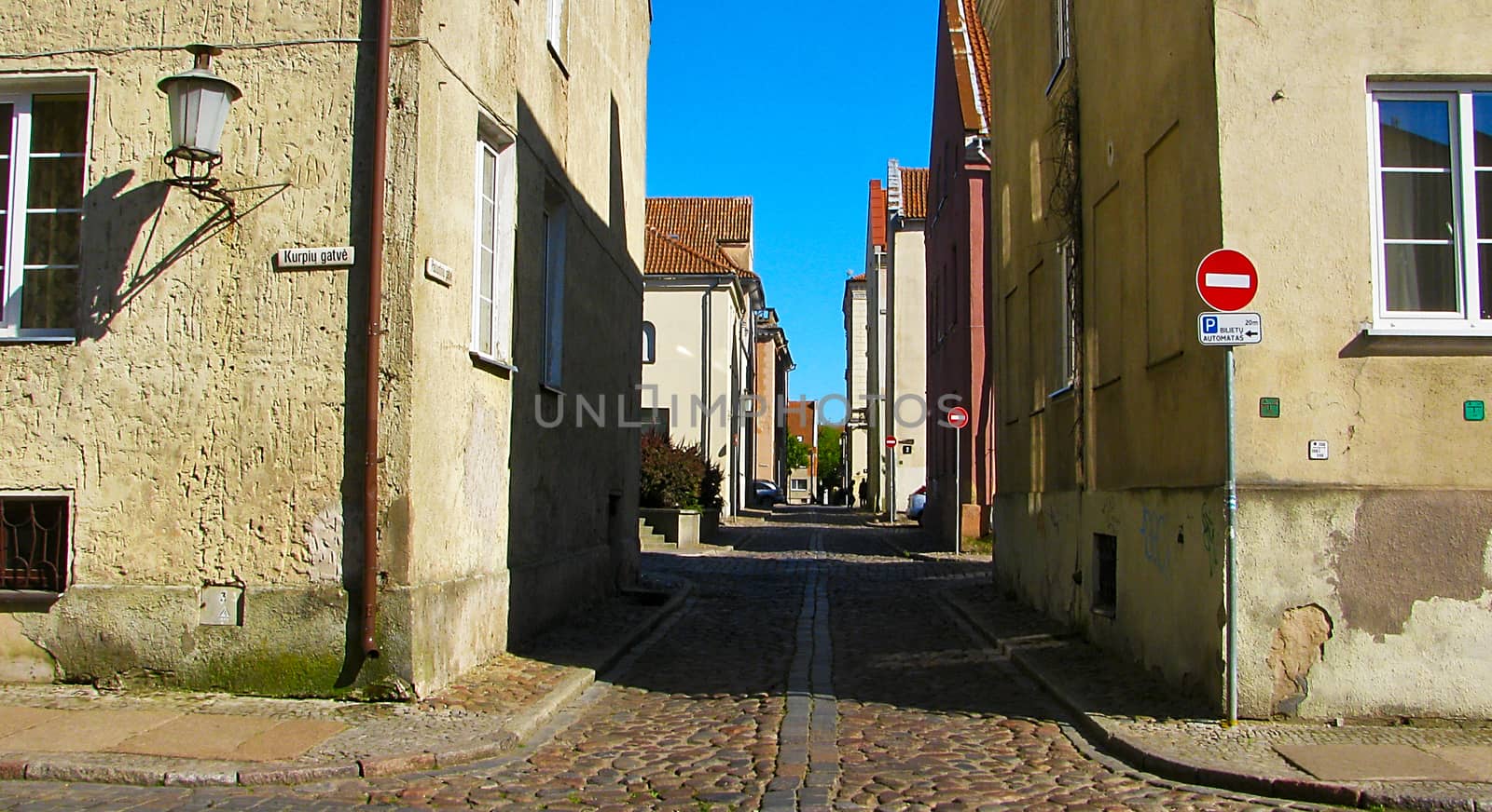 Paved street in the old Klaipeda by Grommik