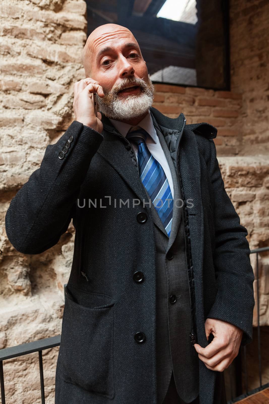 Businessman middle-aged working with a tablet by andongob